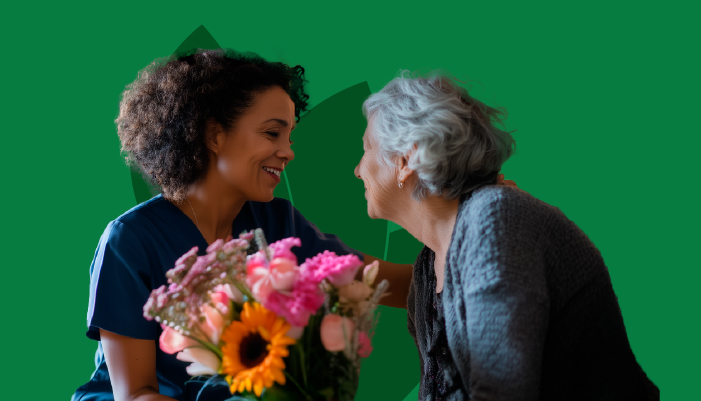 Terapia ocupacional y cuidados paliativos: dignidad y sentido de vida 1 Terapeuta ocupacional acompaña a una persona mayor en cuidados paliativos, dándole flores como símbolo de dignidad y calidad de vida.